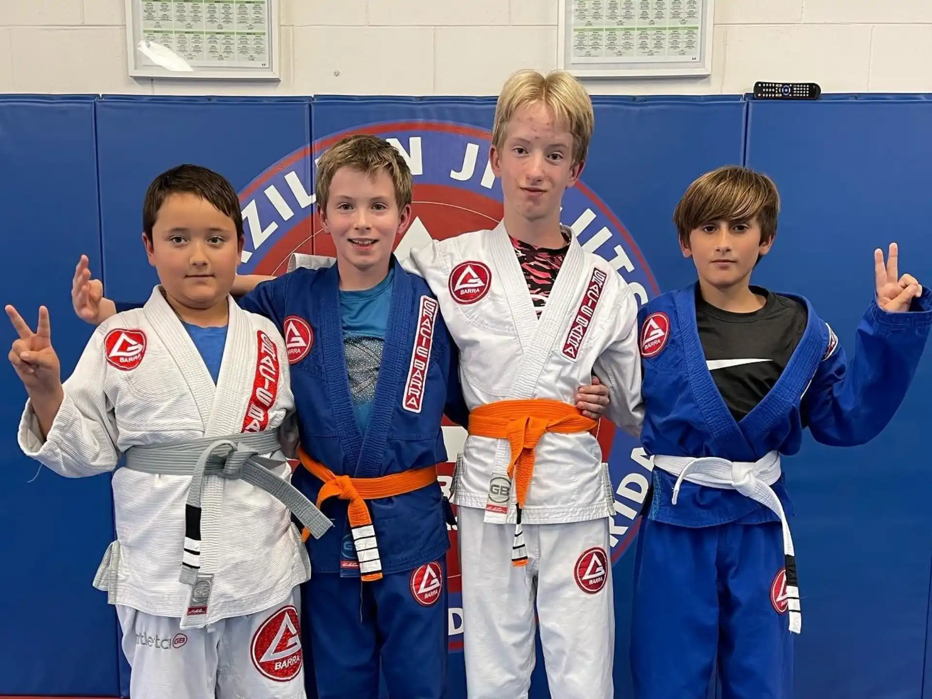 a group of boys in karate uniforms