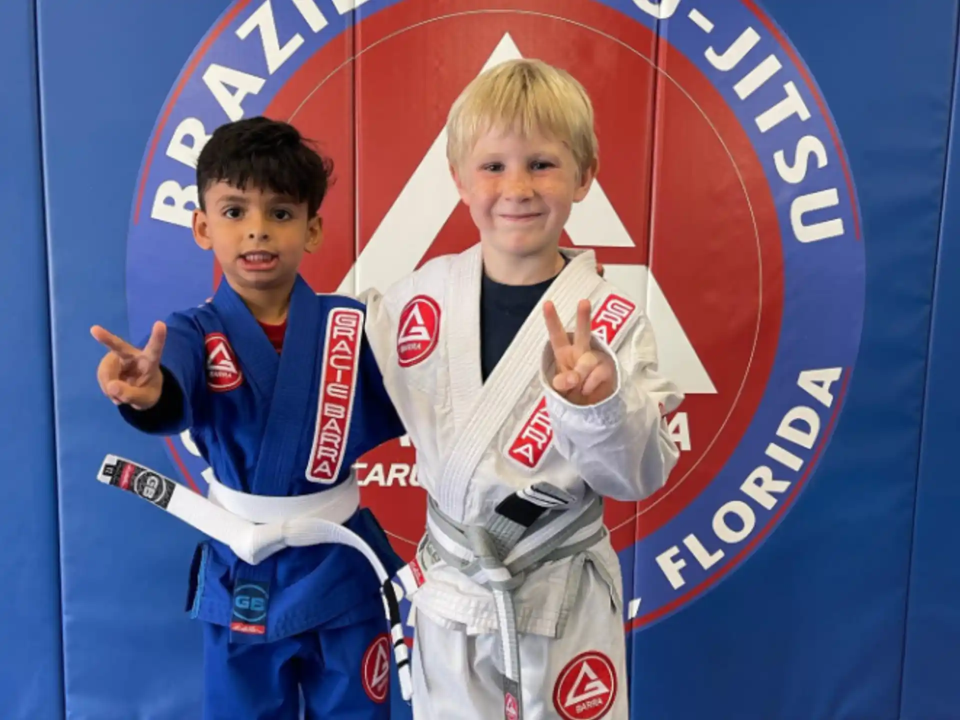 two boys in karate uniforms