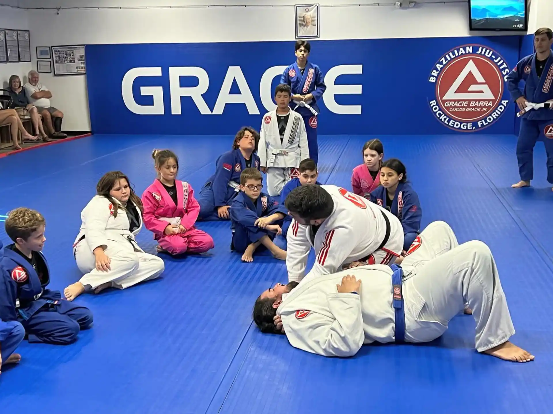 a group of people sitting on the floor