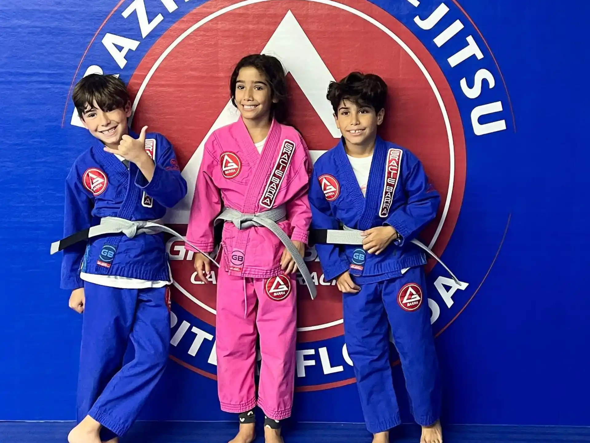 a group of people in karate uniforms