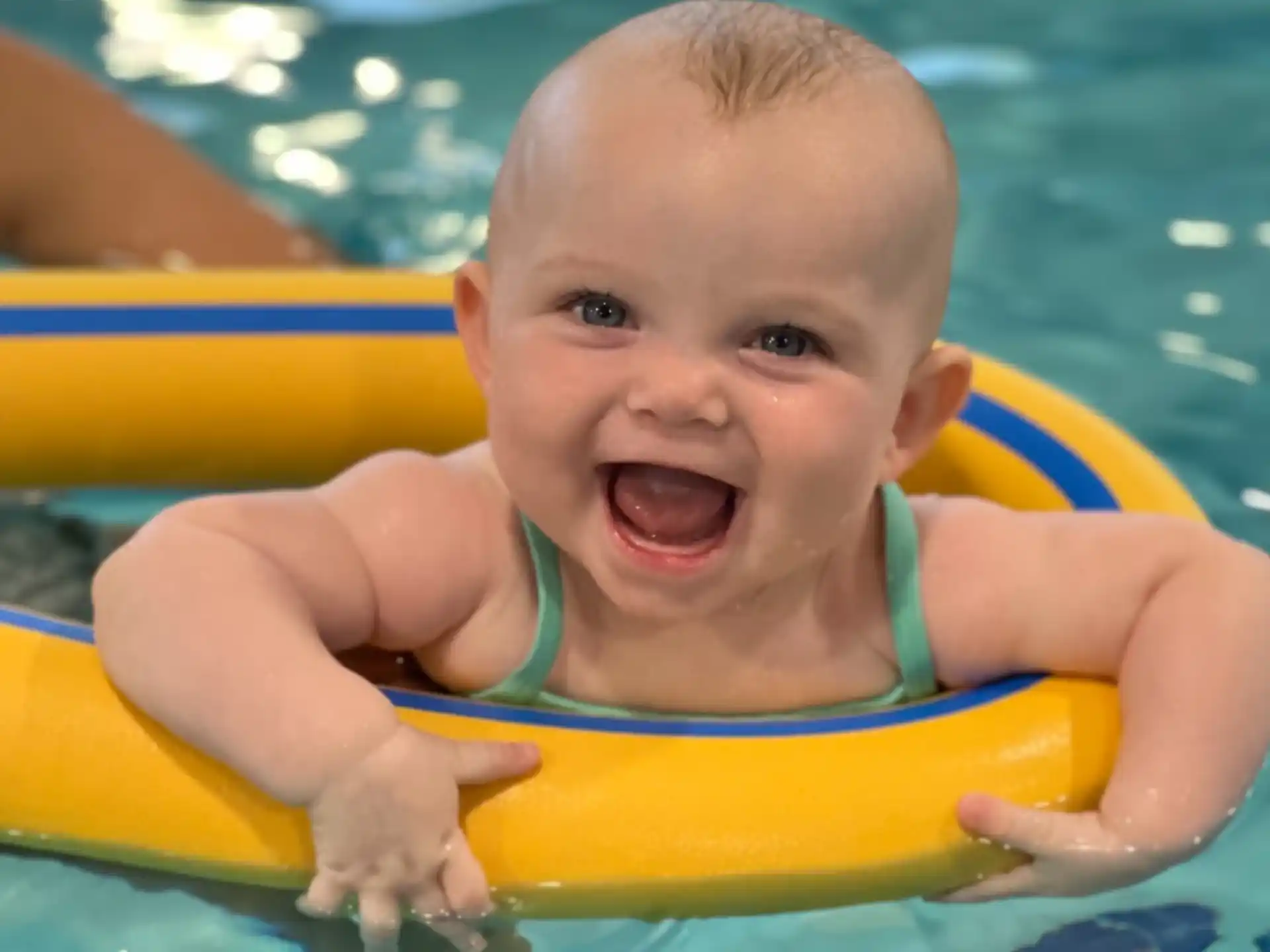 a baby in a pool