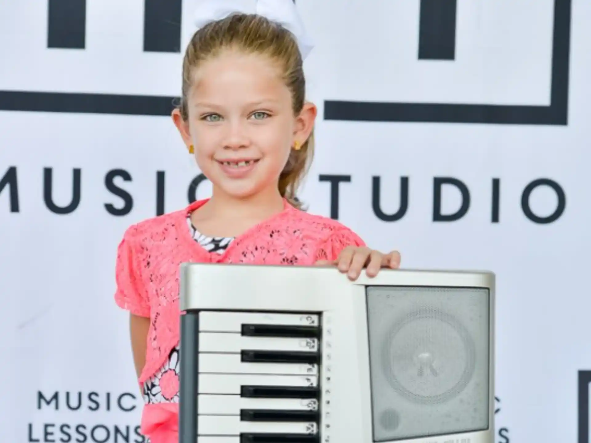 a girl holding a computer