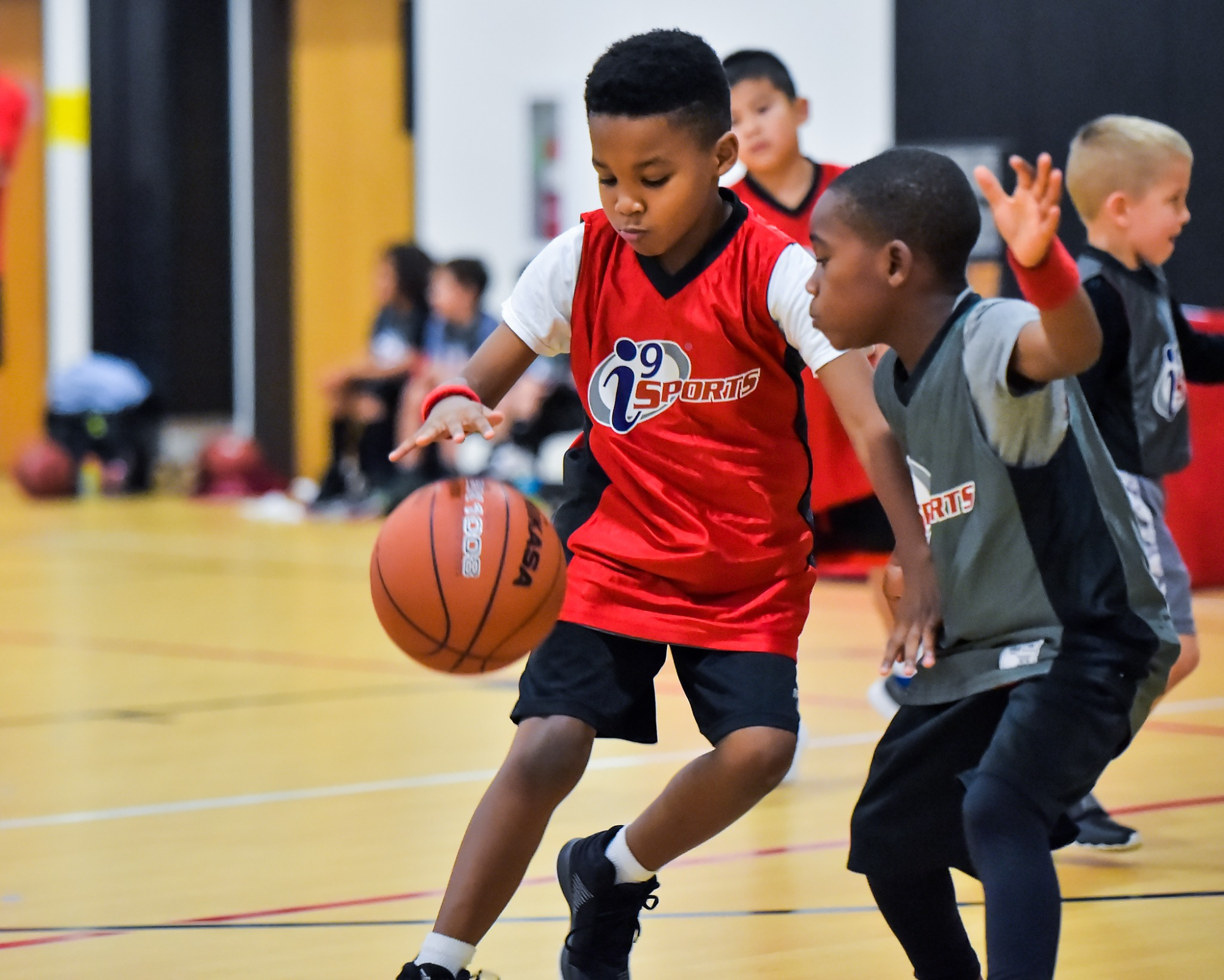 a group of boys playing basketball