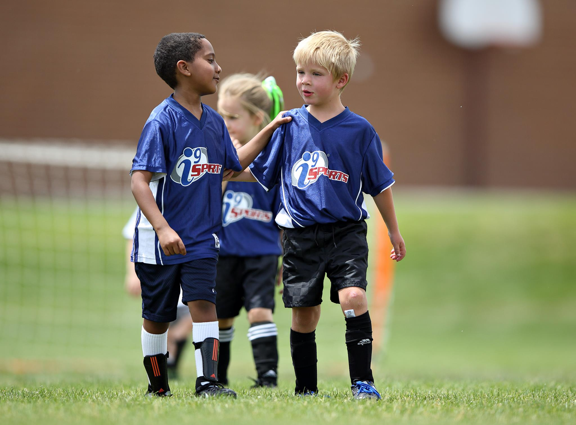 a group of kids in blue uniforms