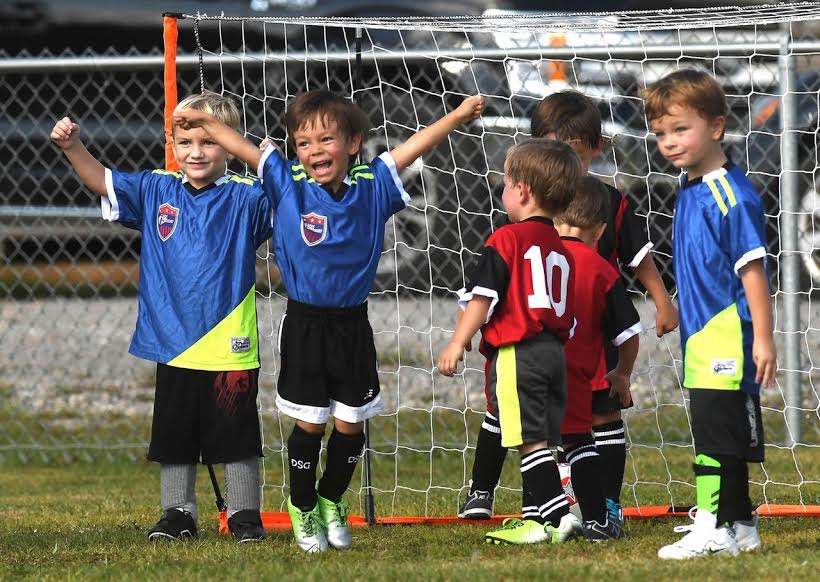 a group of boys in football uniforms