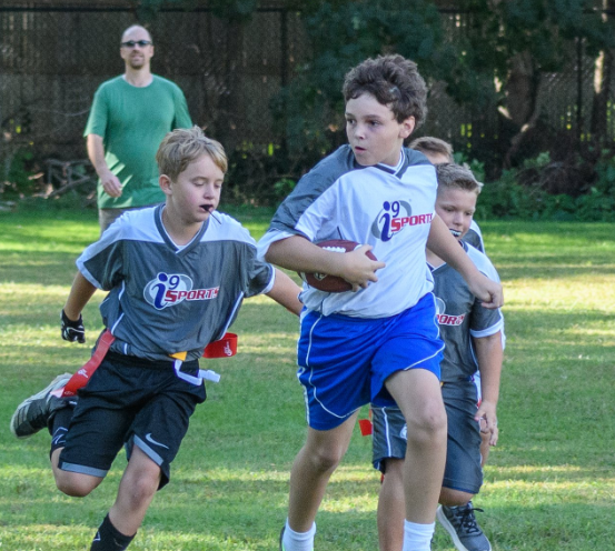 a group of boys playing football