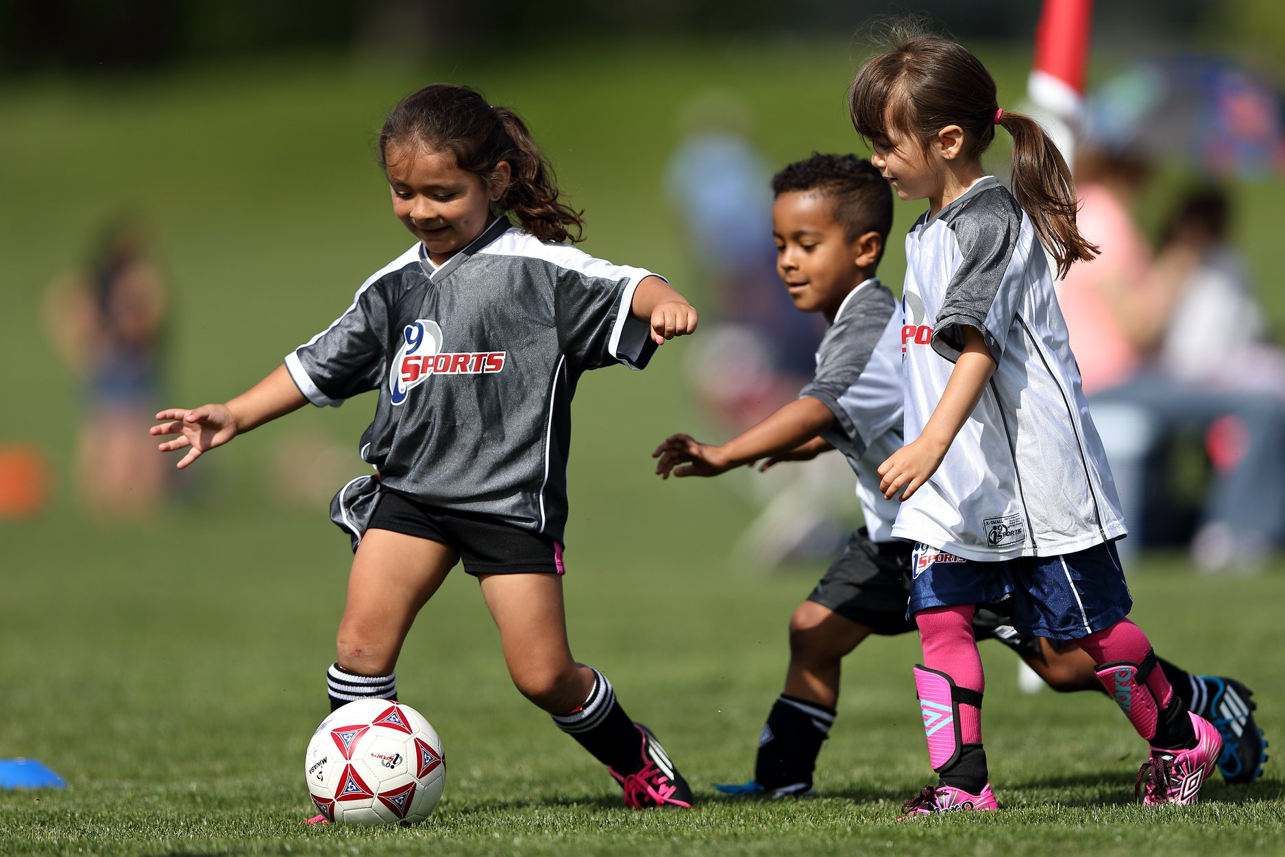 a group of young girls playing football