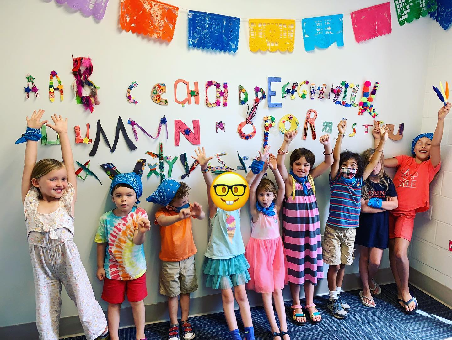 a group of children posing for a photo