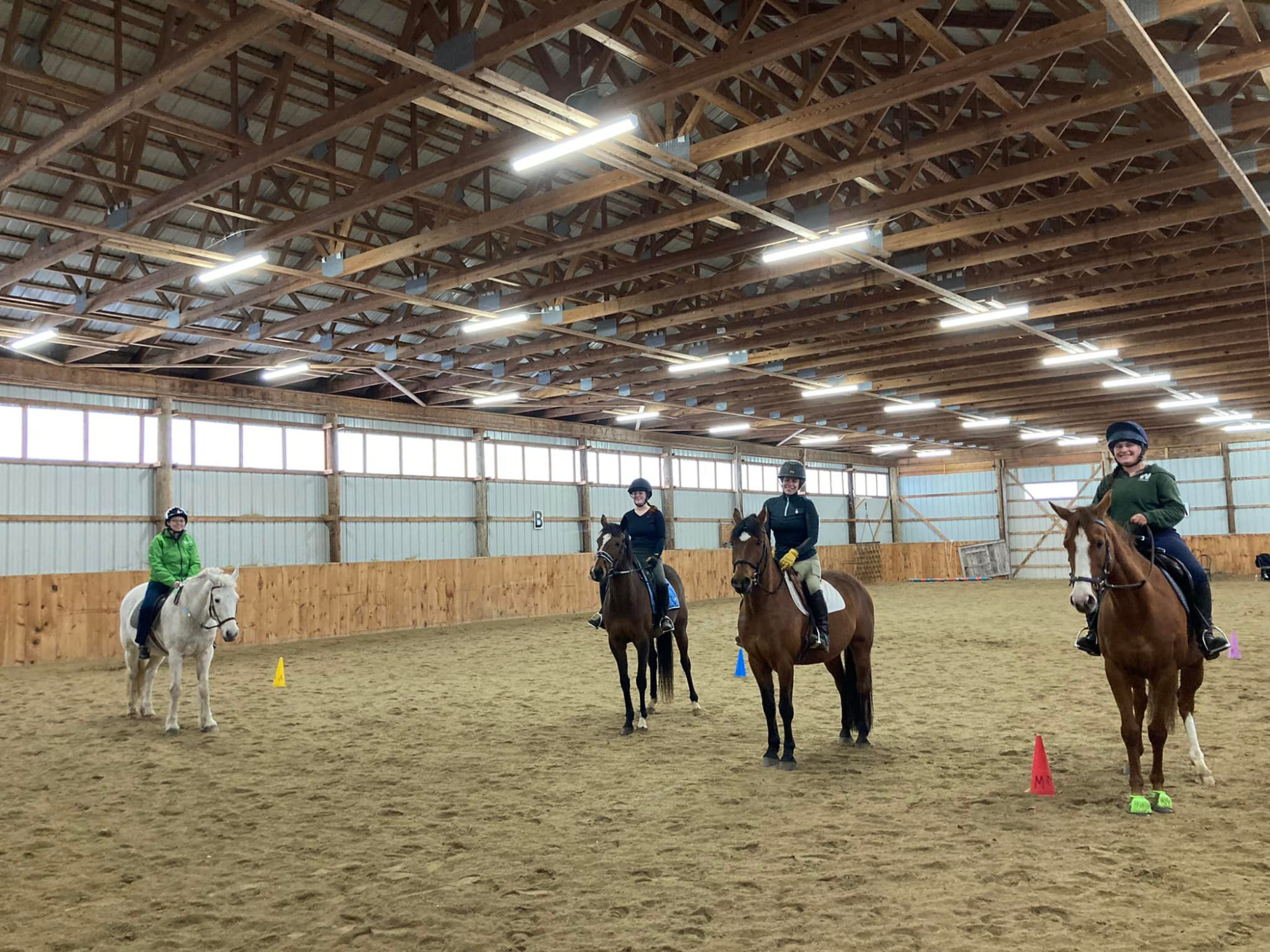 a group of people riding horses