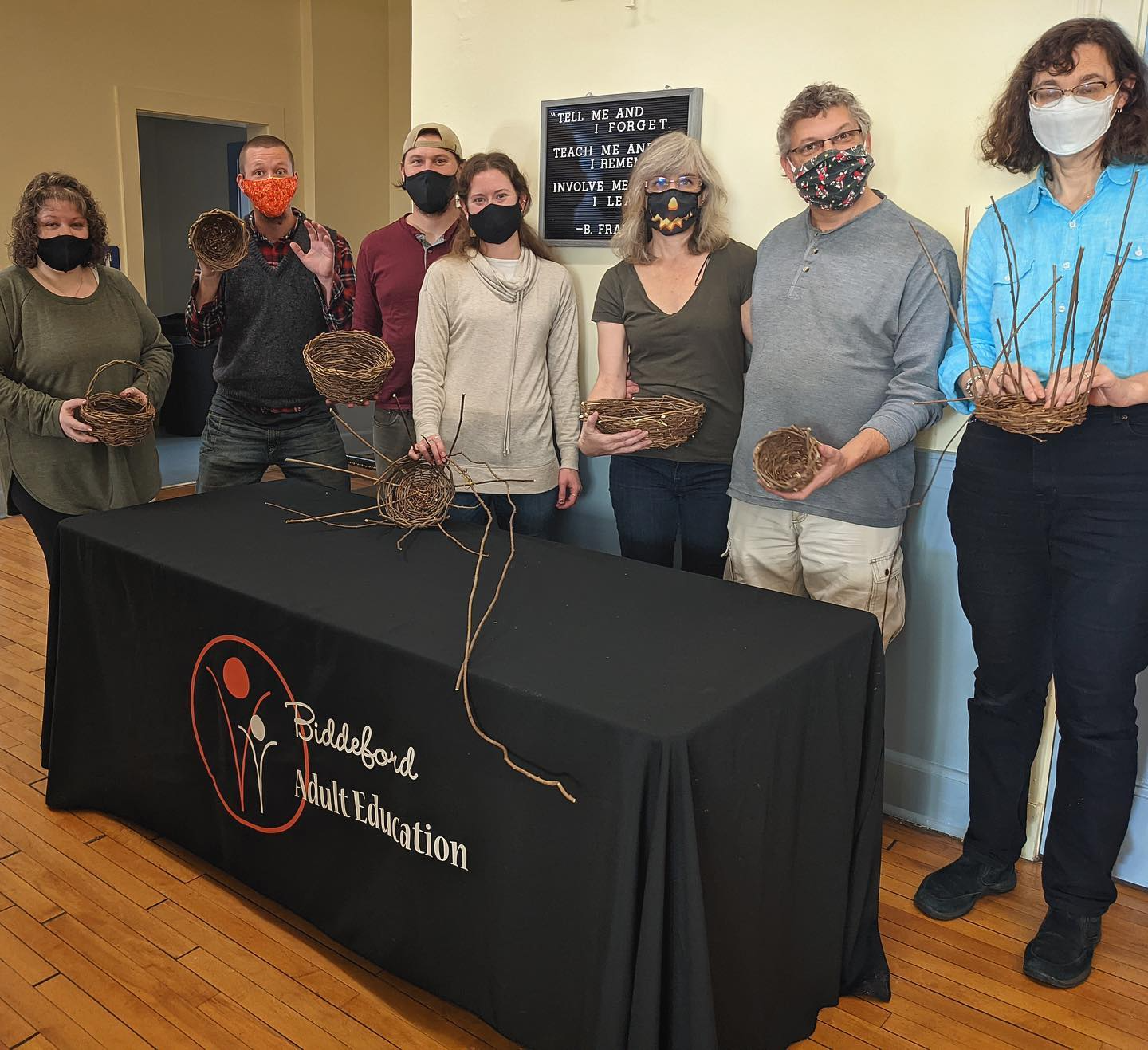 a group of people wearing masks