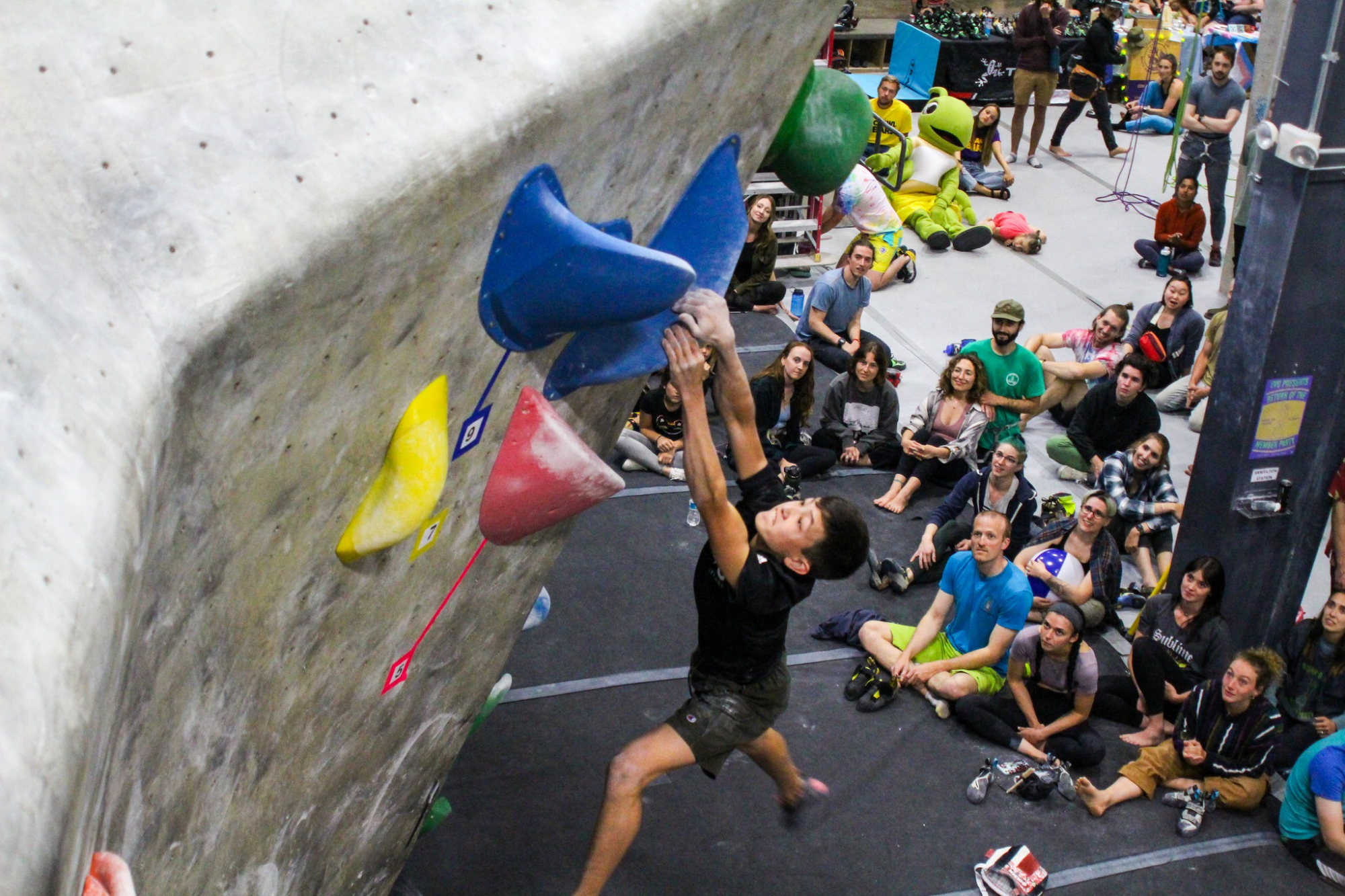 a person in a garment in front of a crowd of people