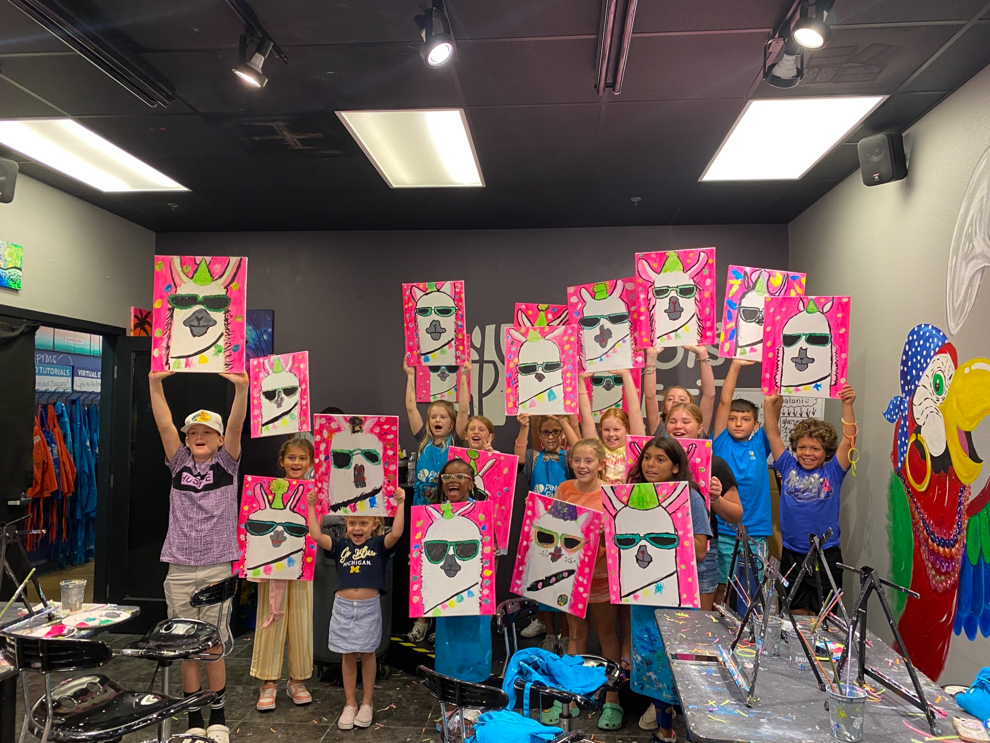 a group of children holding up posters