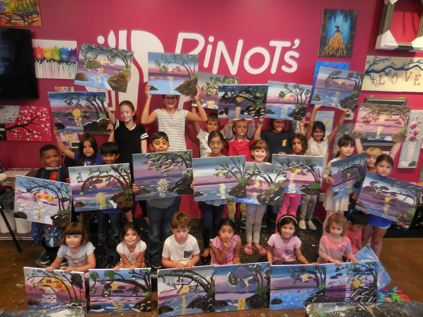 a group of children holding books