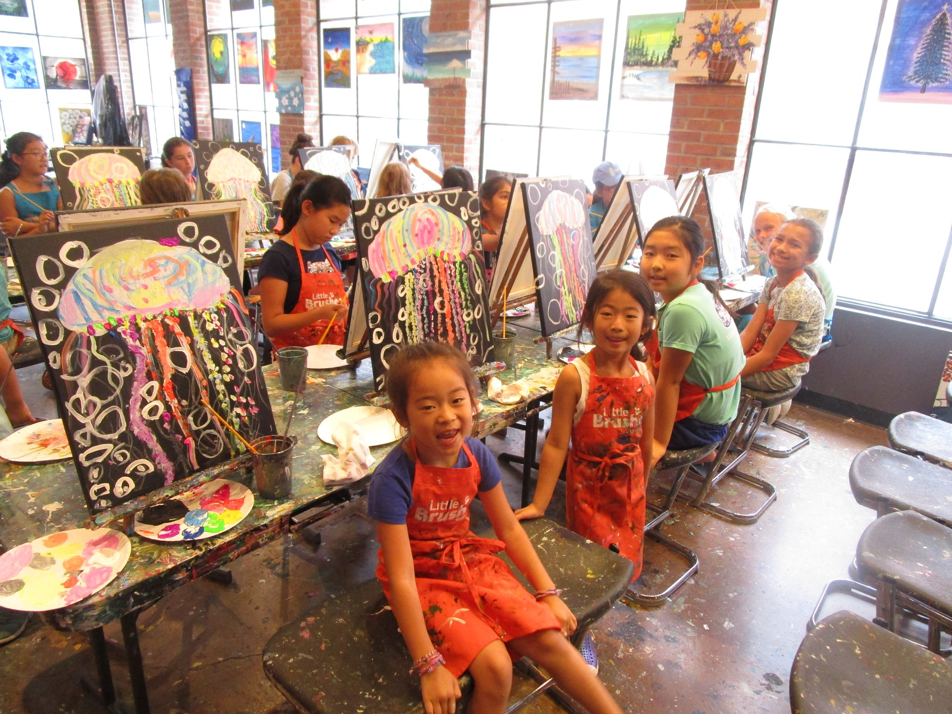 a group of children sitting at a table