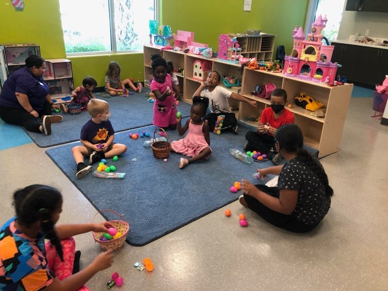 a group of children playing with toys