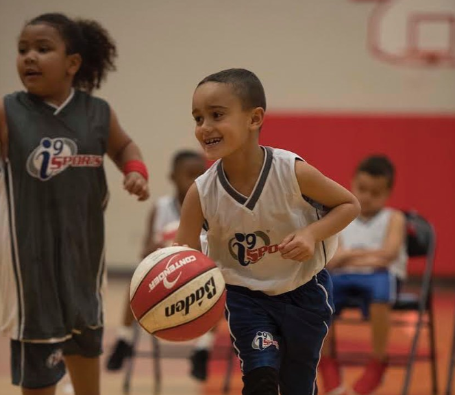 a couple of kids playing basketball