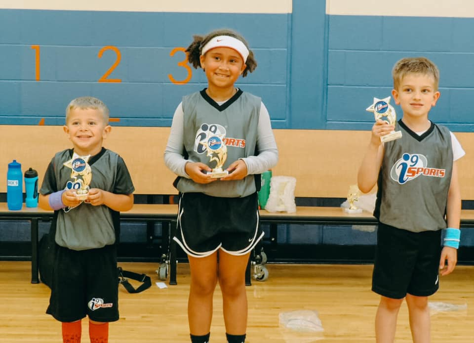 a group of kids holding small toys