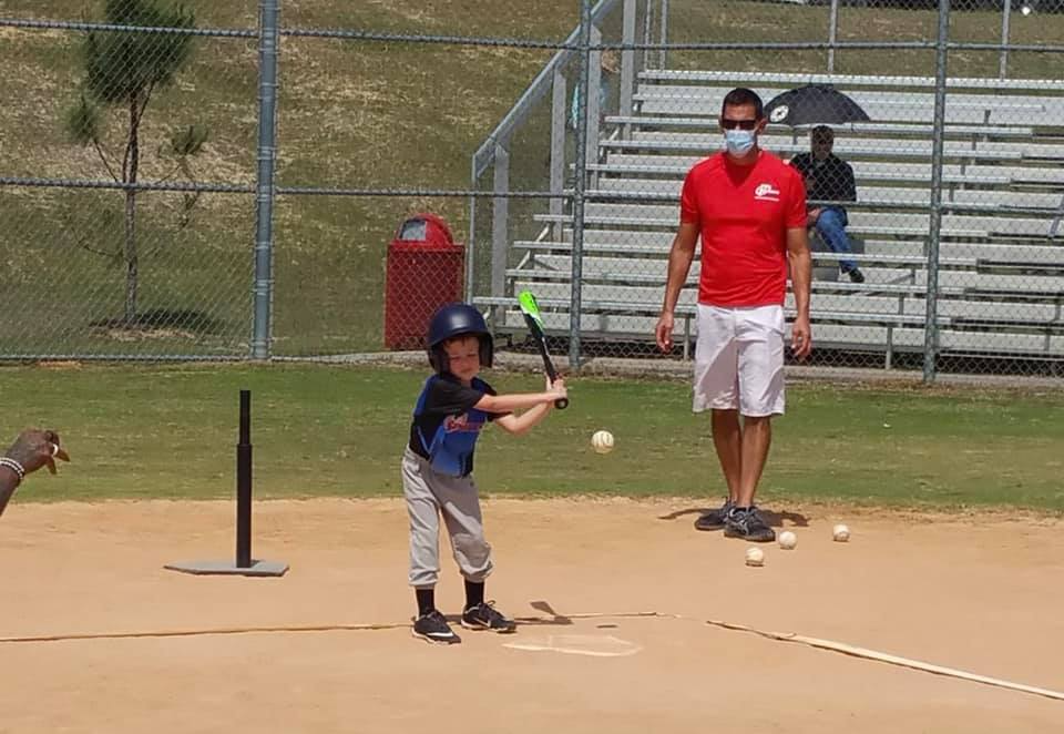 a kid holding a baseball bat