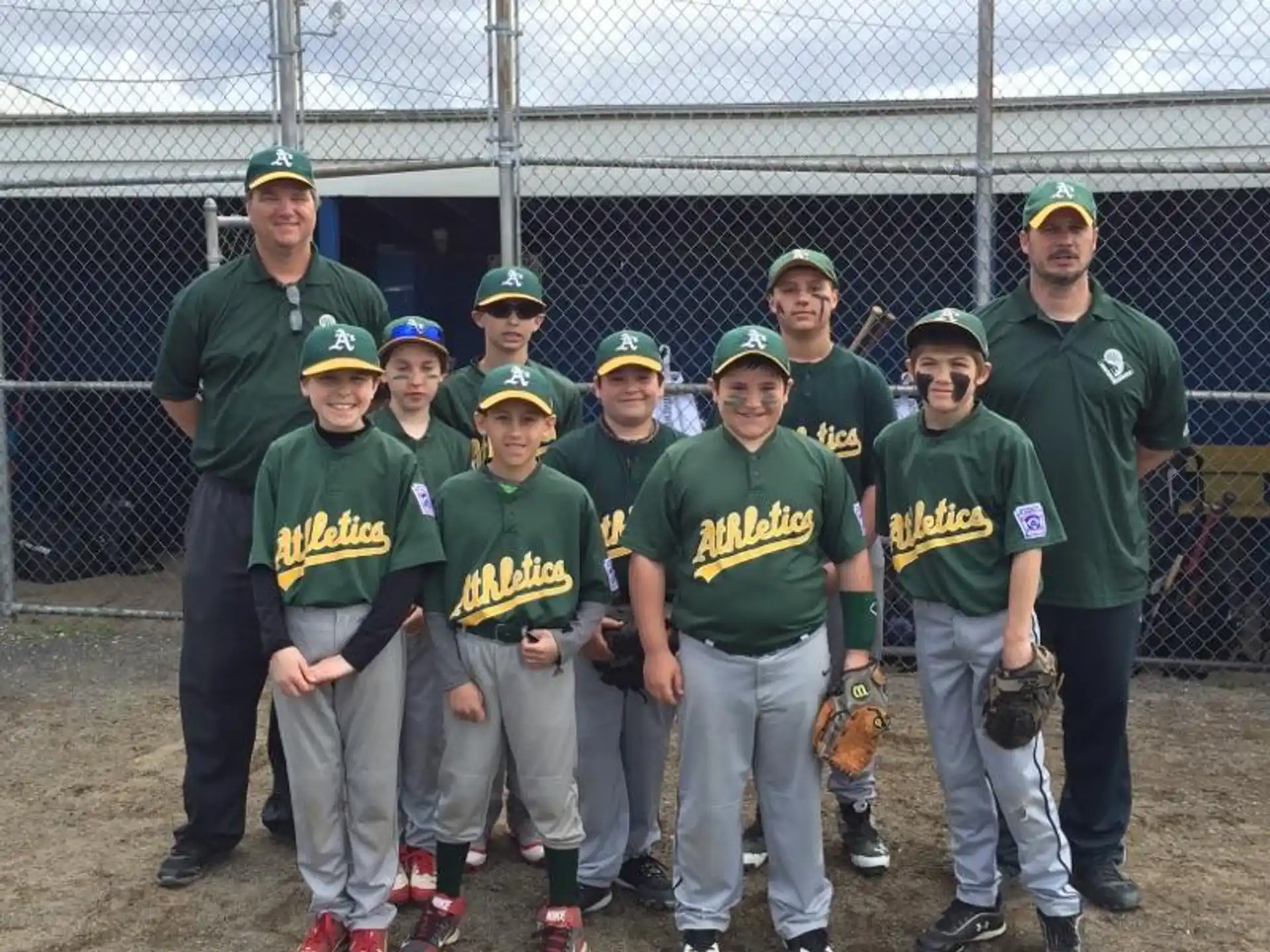 a group of baseball players pose for a photo