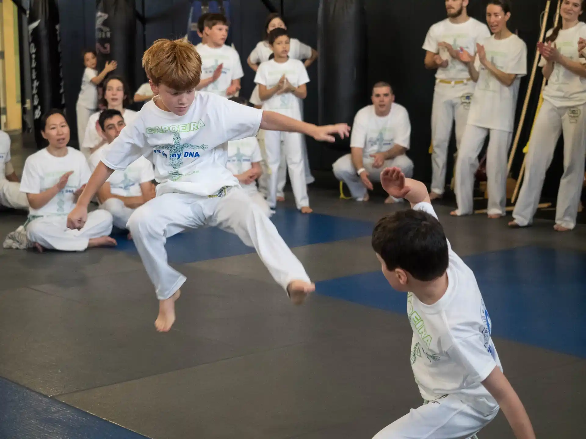 a group of people in karate uniforms