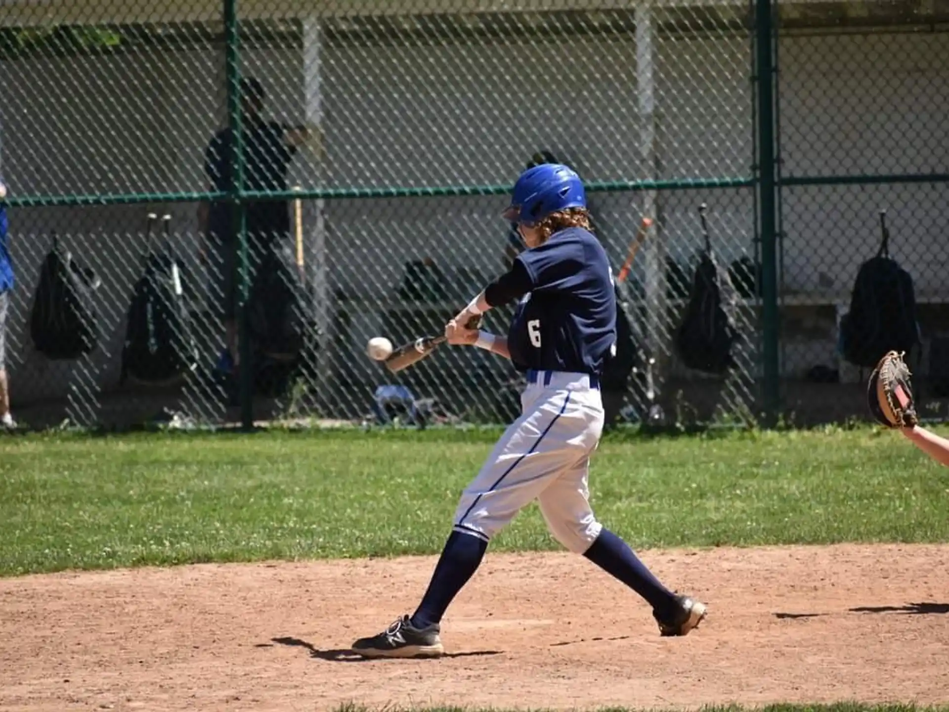 a baseball player swinging a bat
