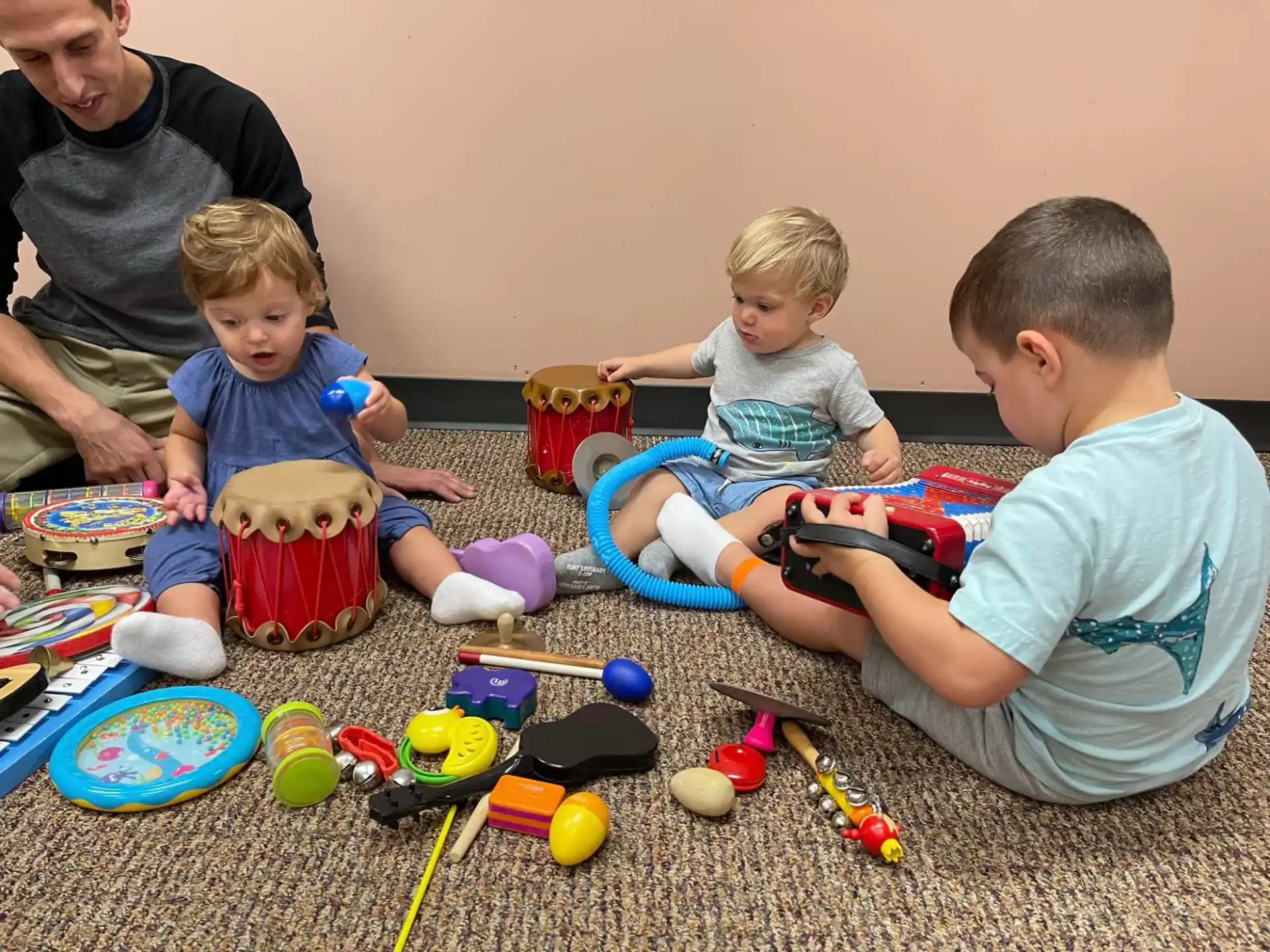 a group of children playing with toys