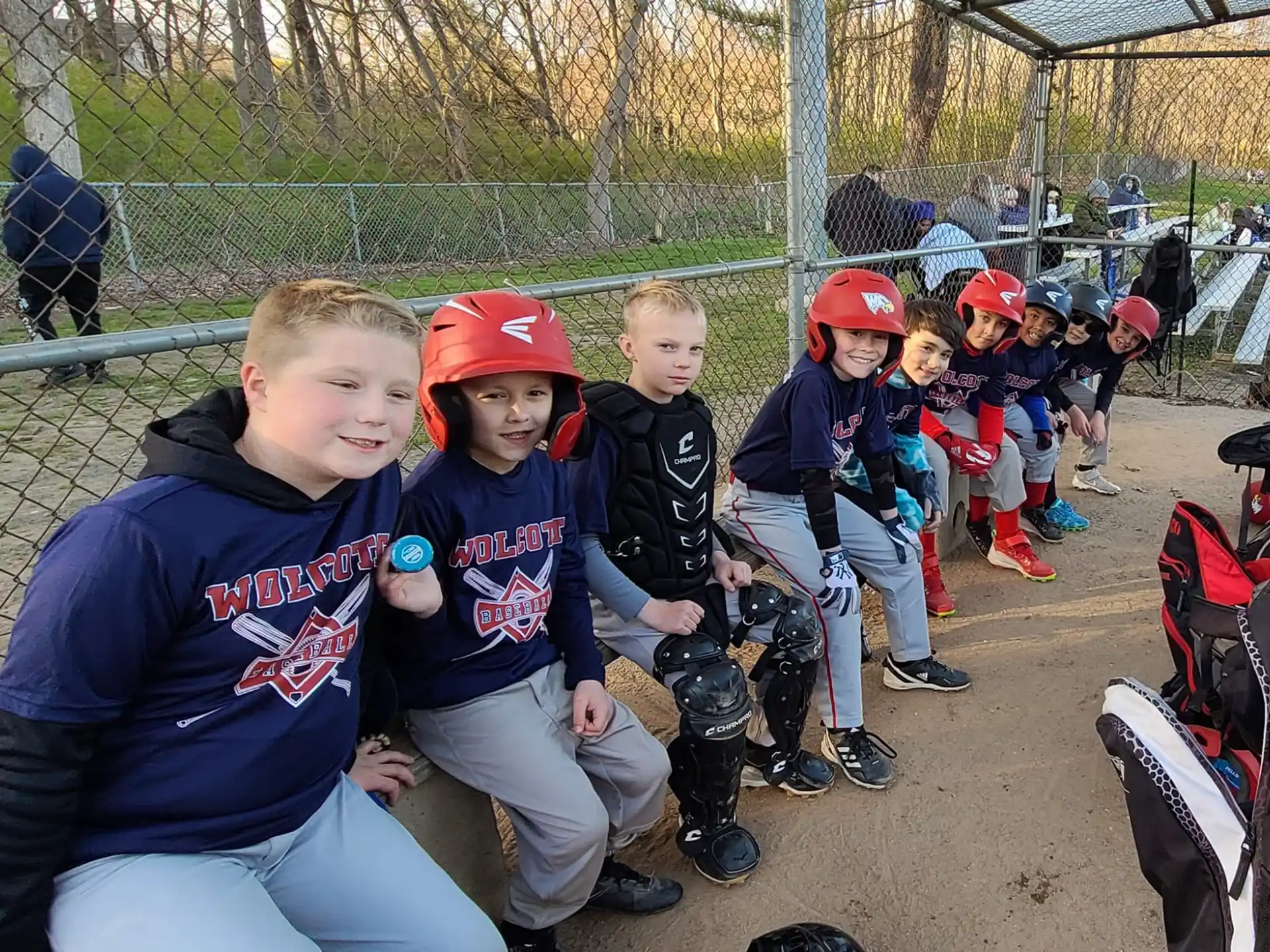 a group of kids sitting on a bench