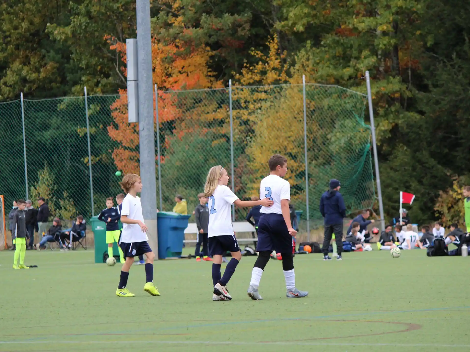 a group of kids playing football
