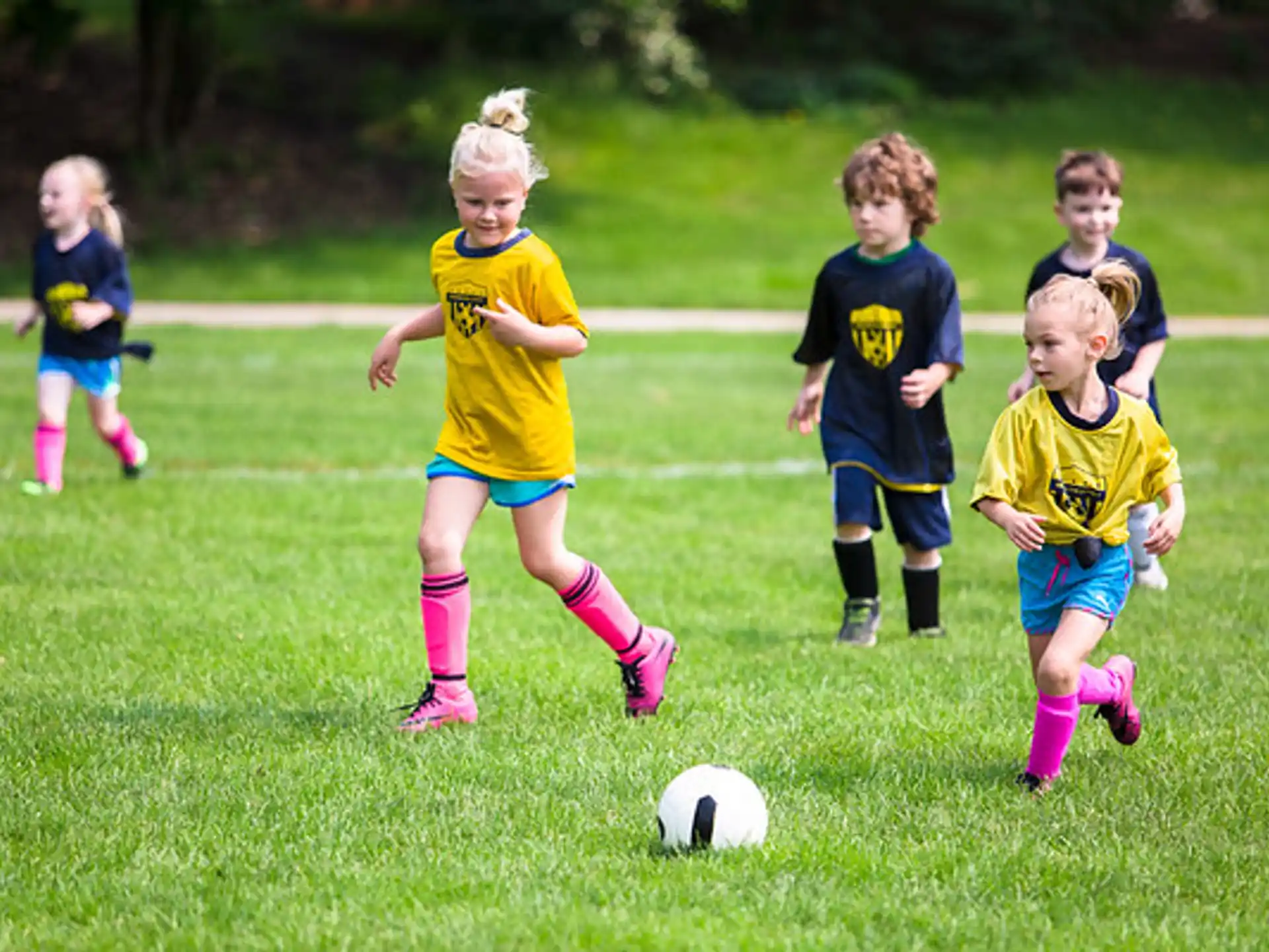 a group of kids playing football