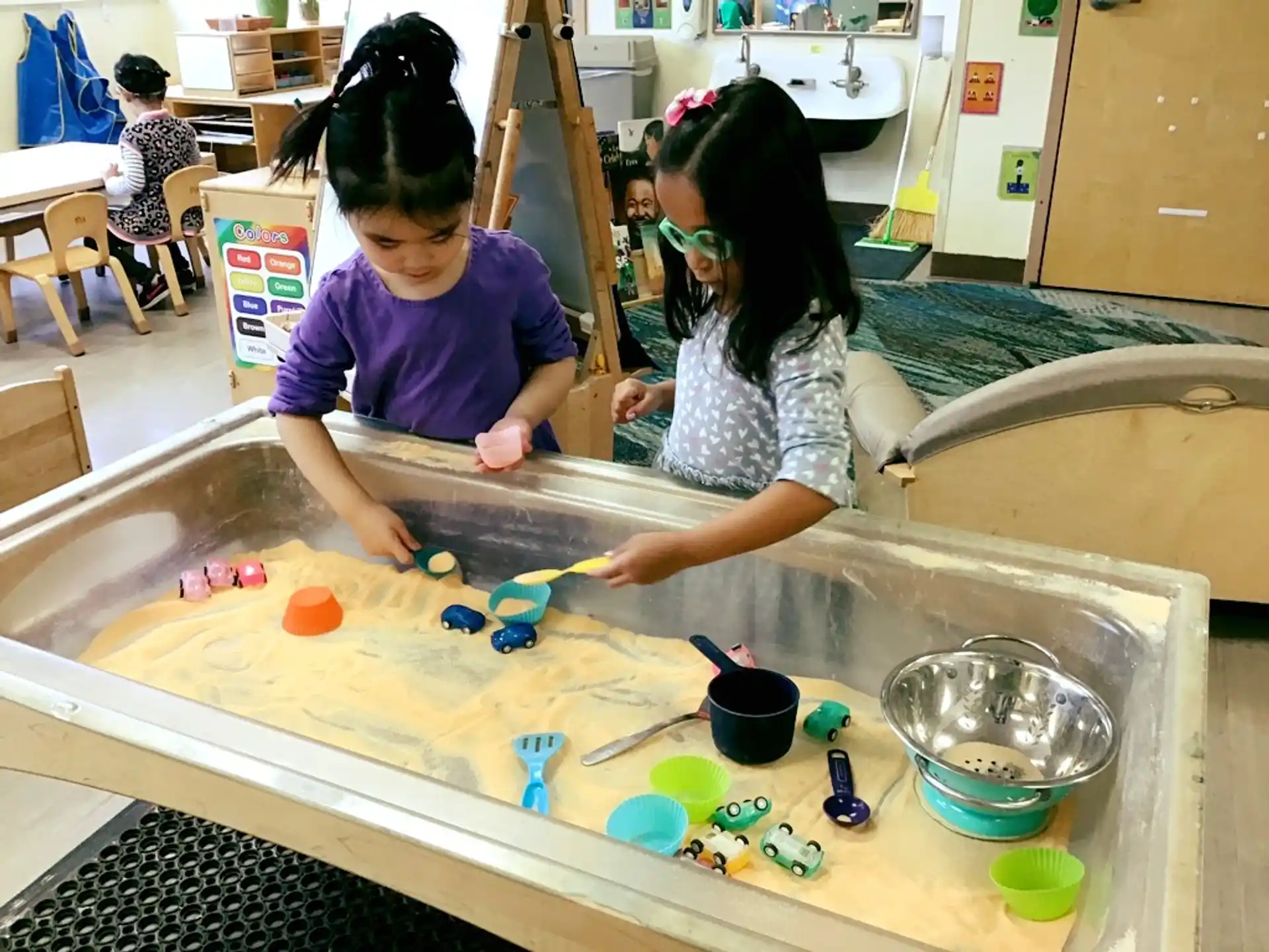 a couple of kids playing with toys