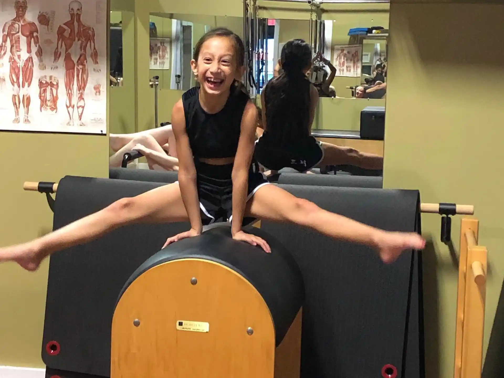 a person sitting on a large exercise machine