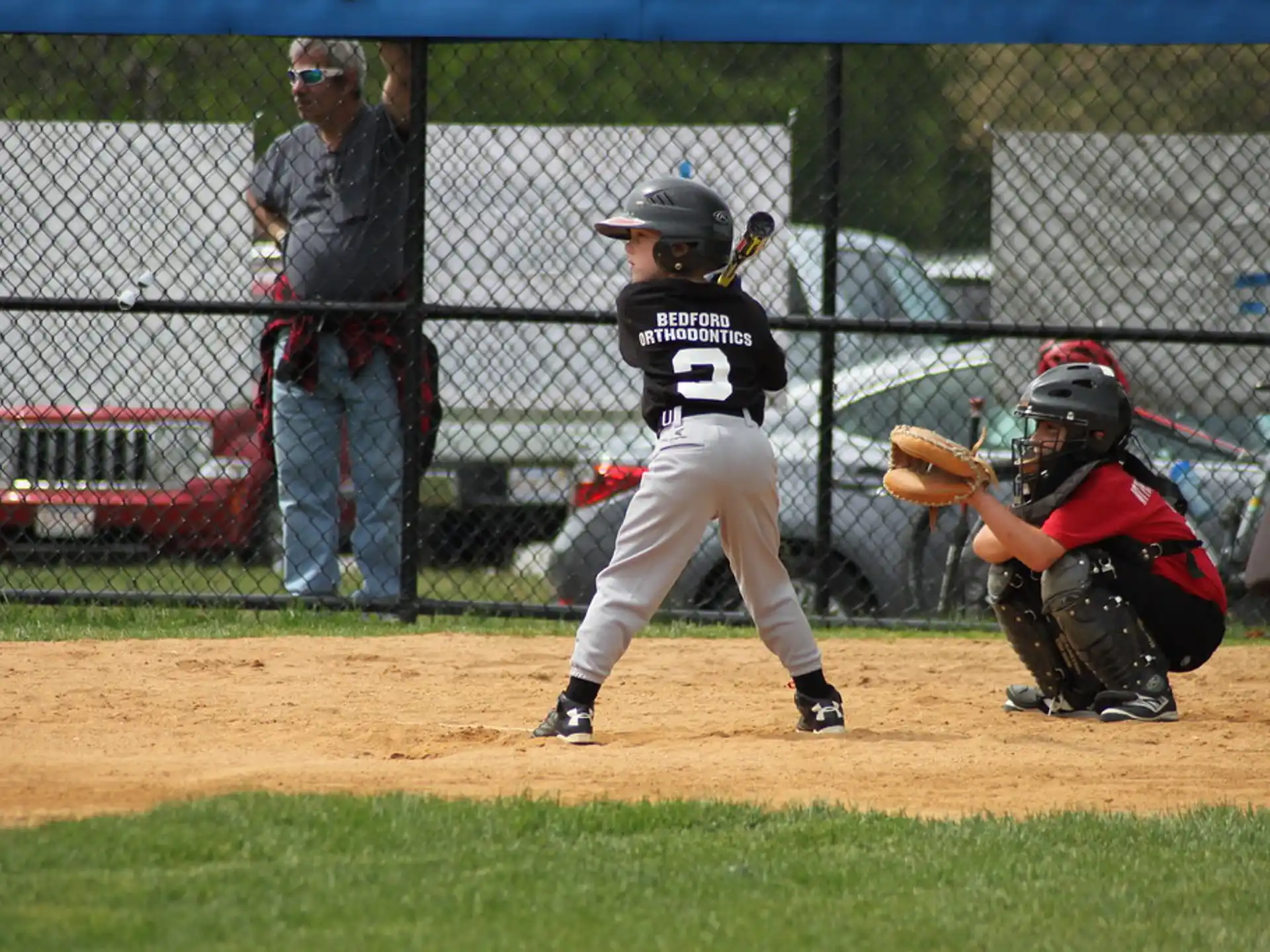 a kid swinging a baseball bat
