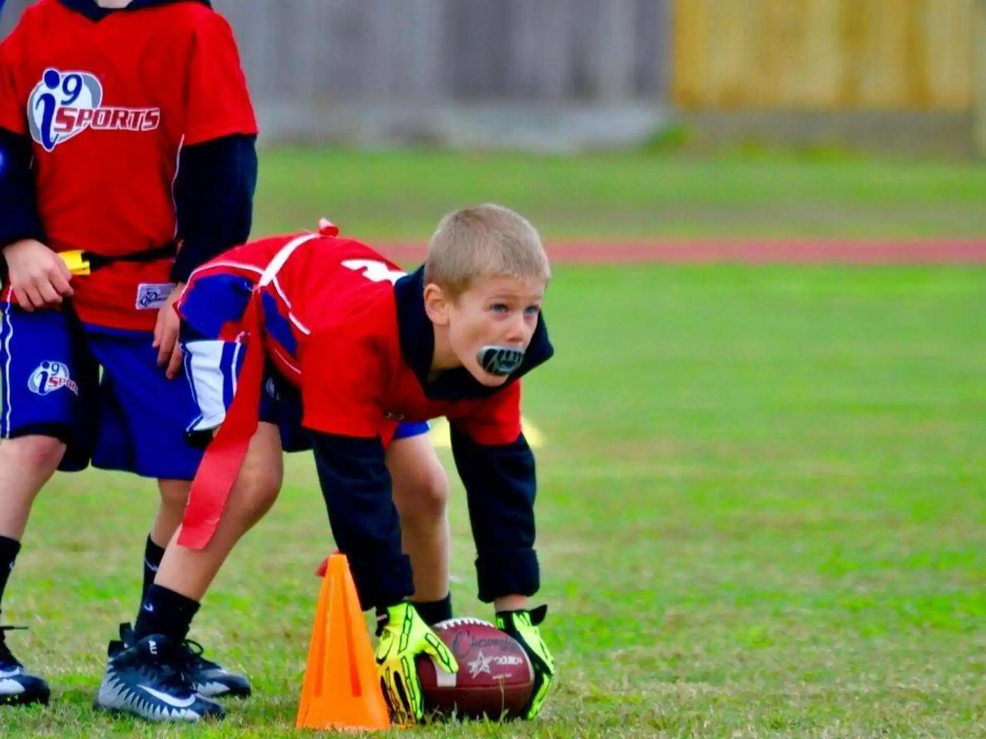 a group of boys playing football
