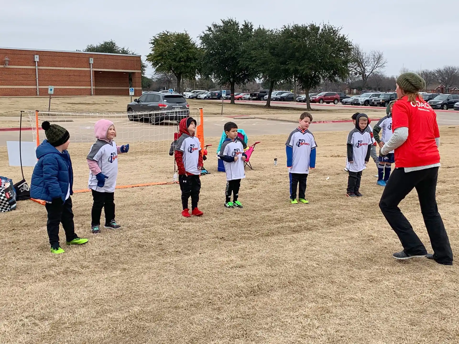 a group of kids standing on a field