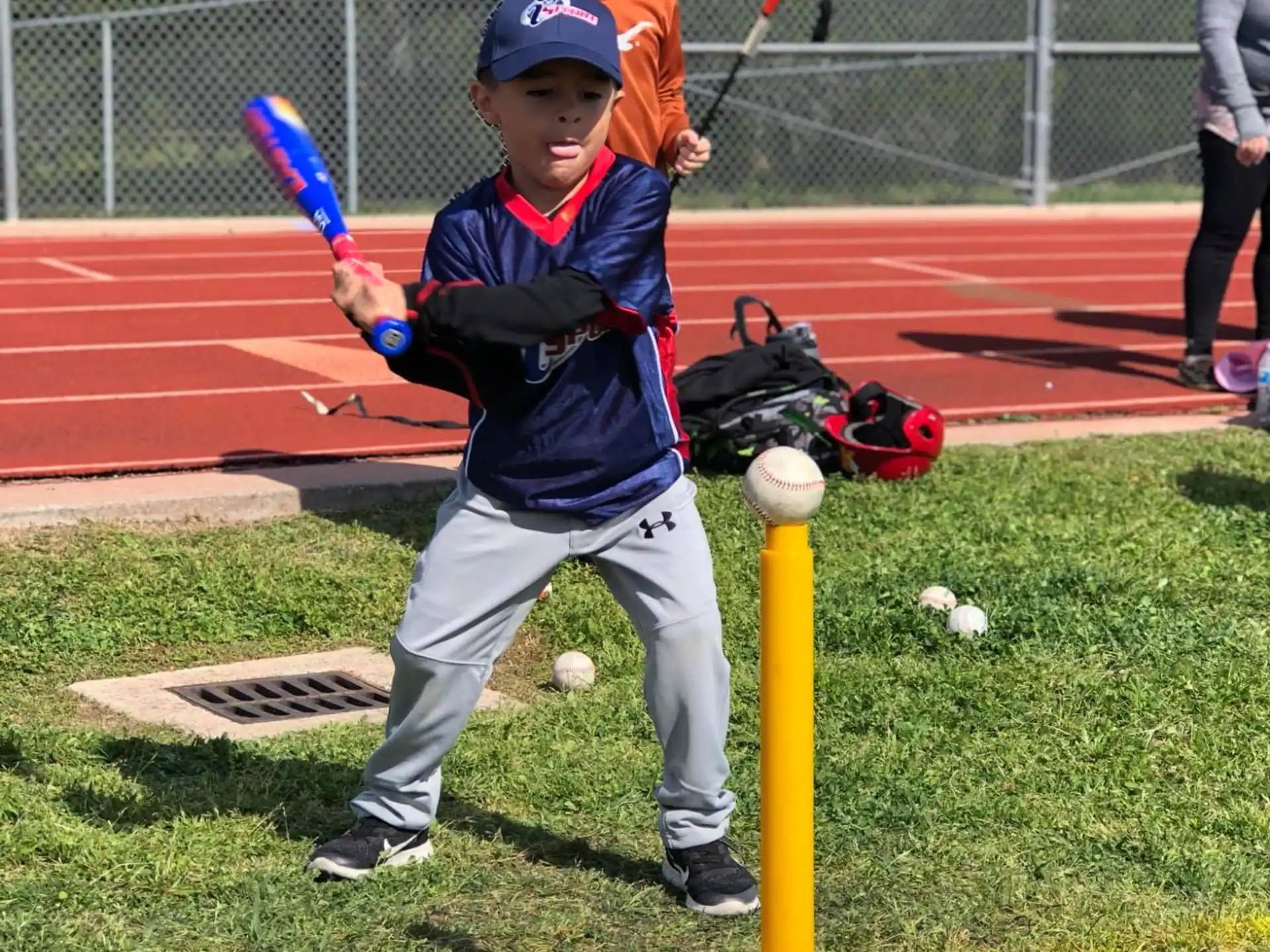 a kid holding a baseball bat