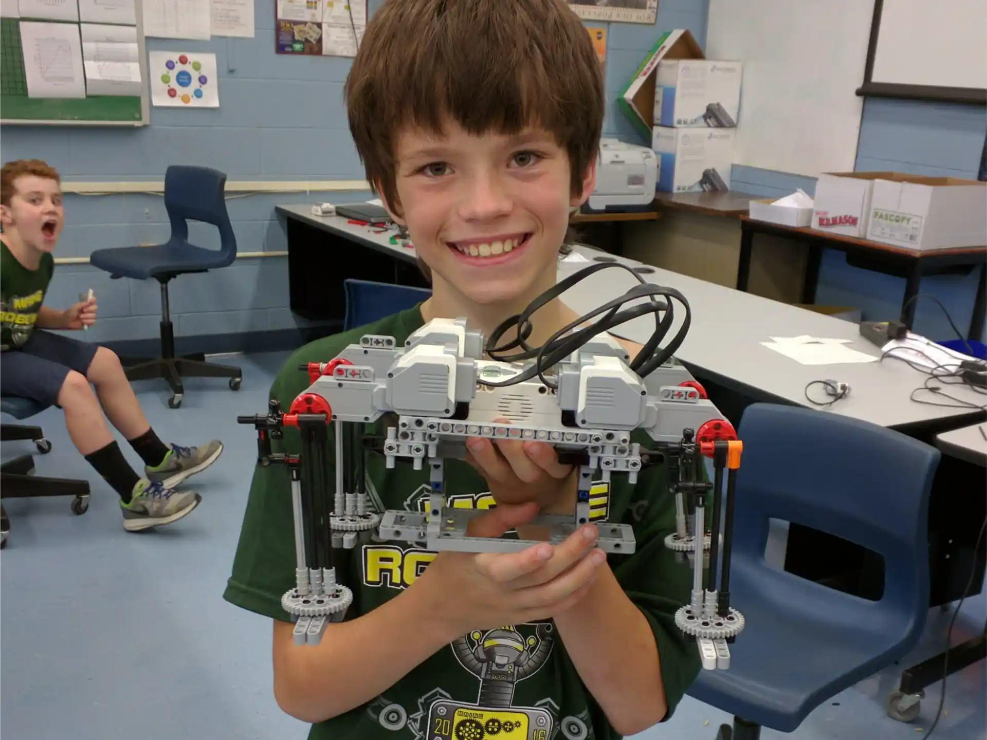 a boy holding up his hand