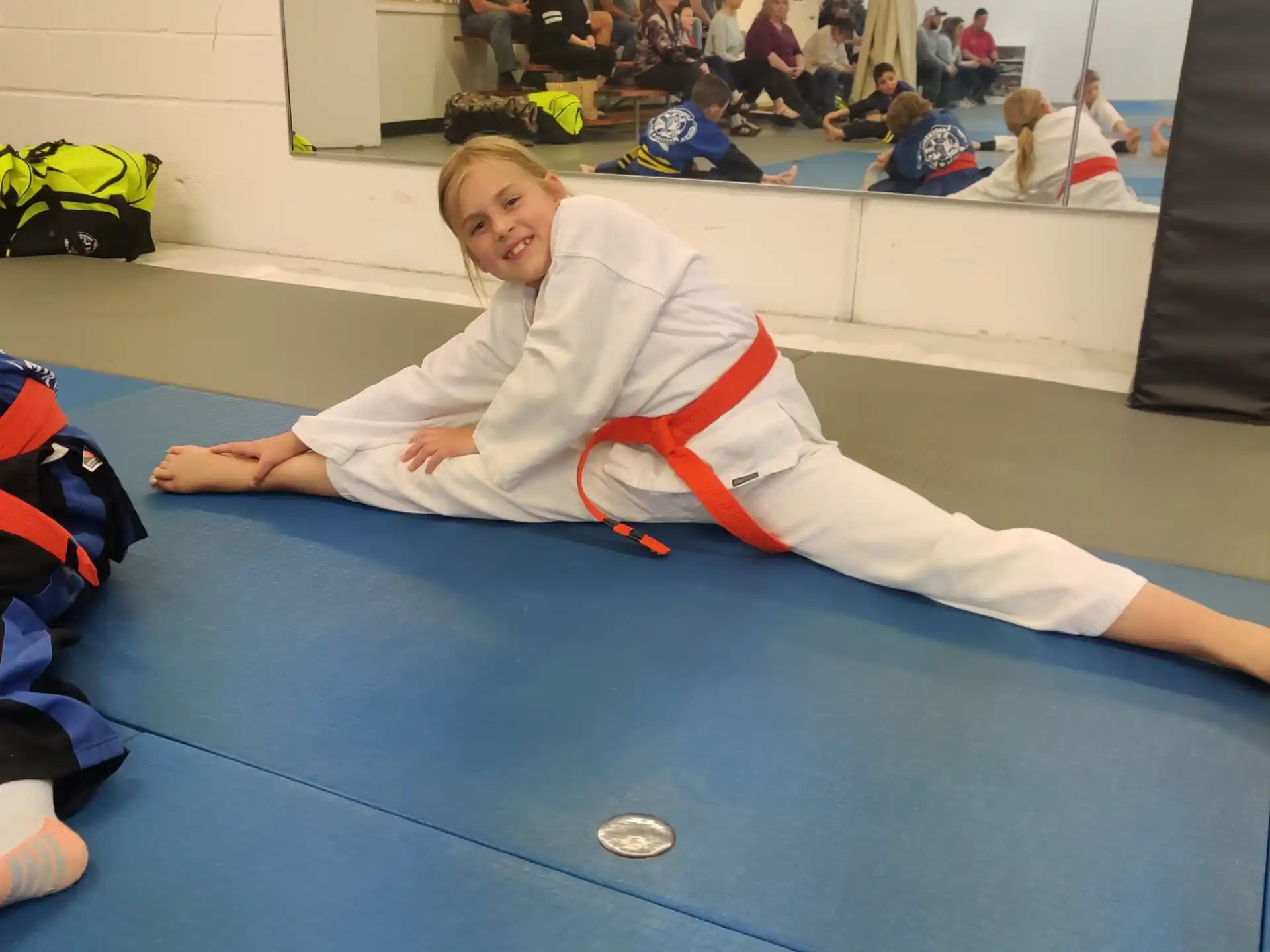 a boy lying on a mat