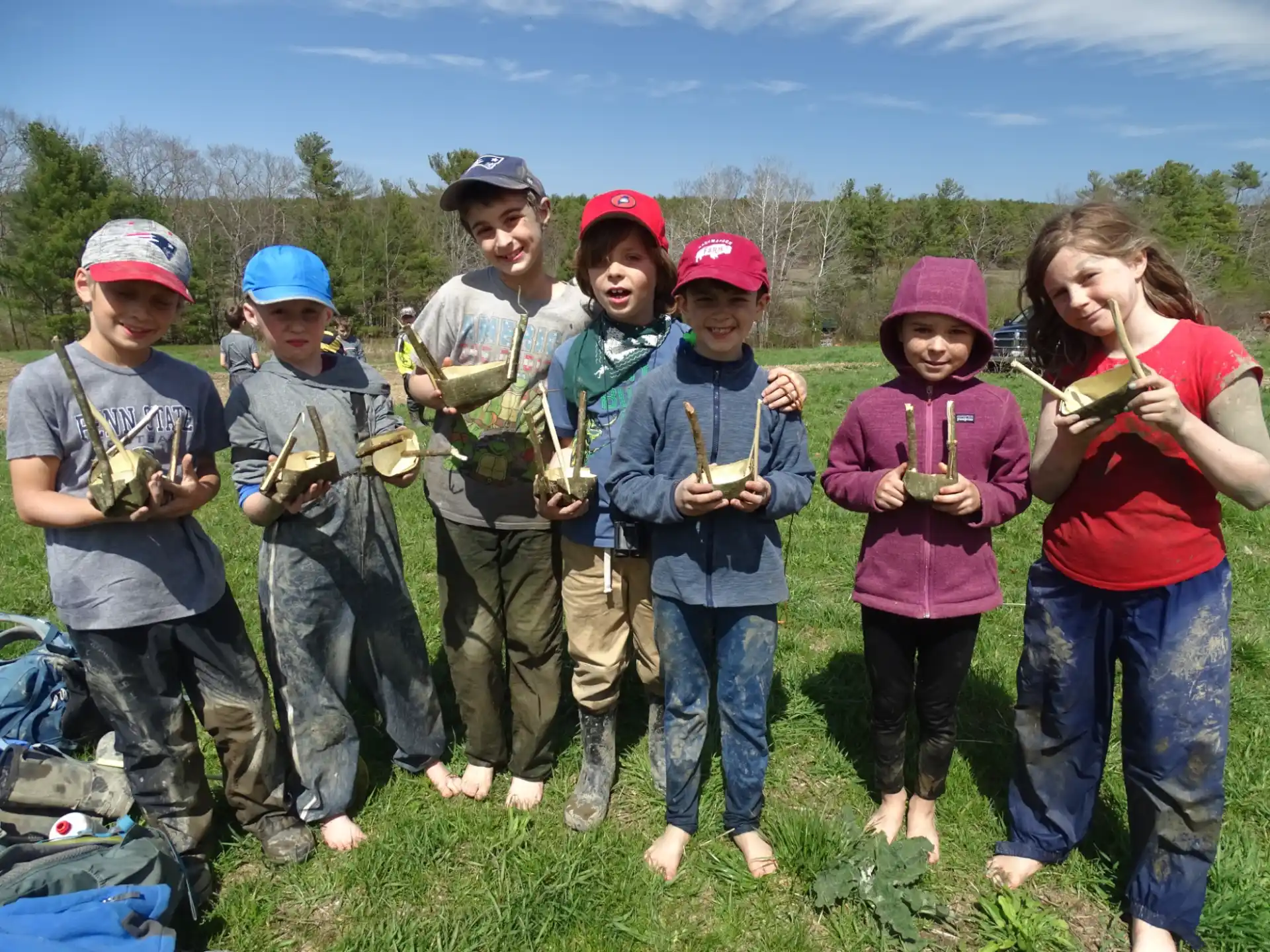 a group of kids holding fish