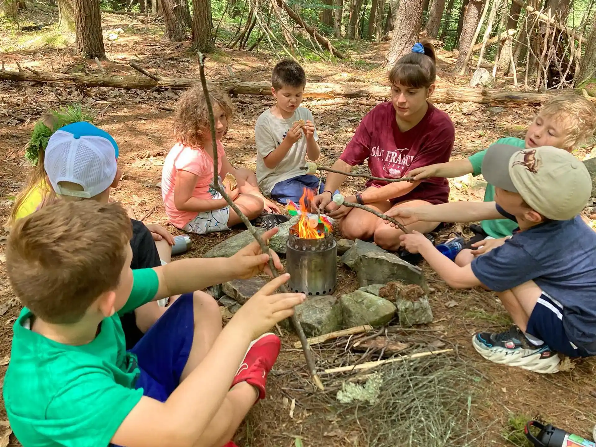 a group of people around a fire
