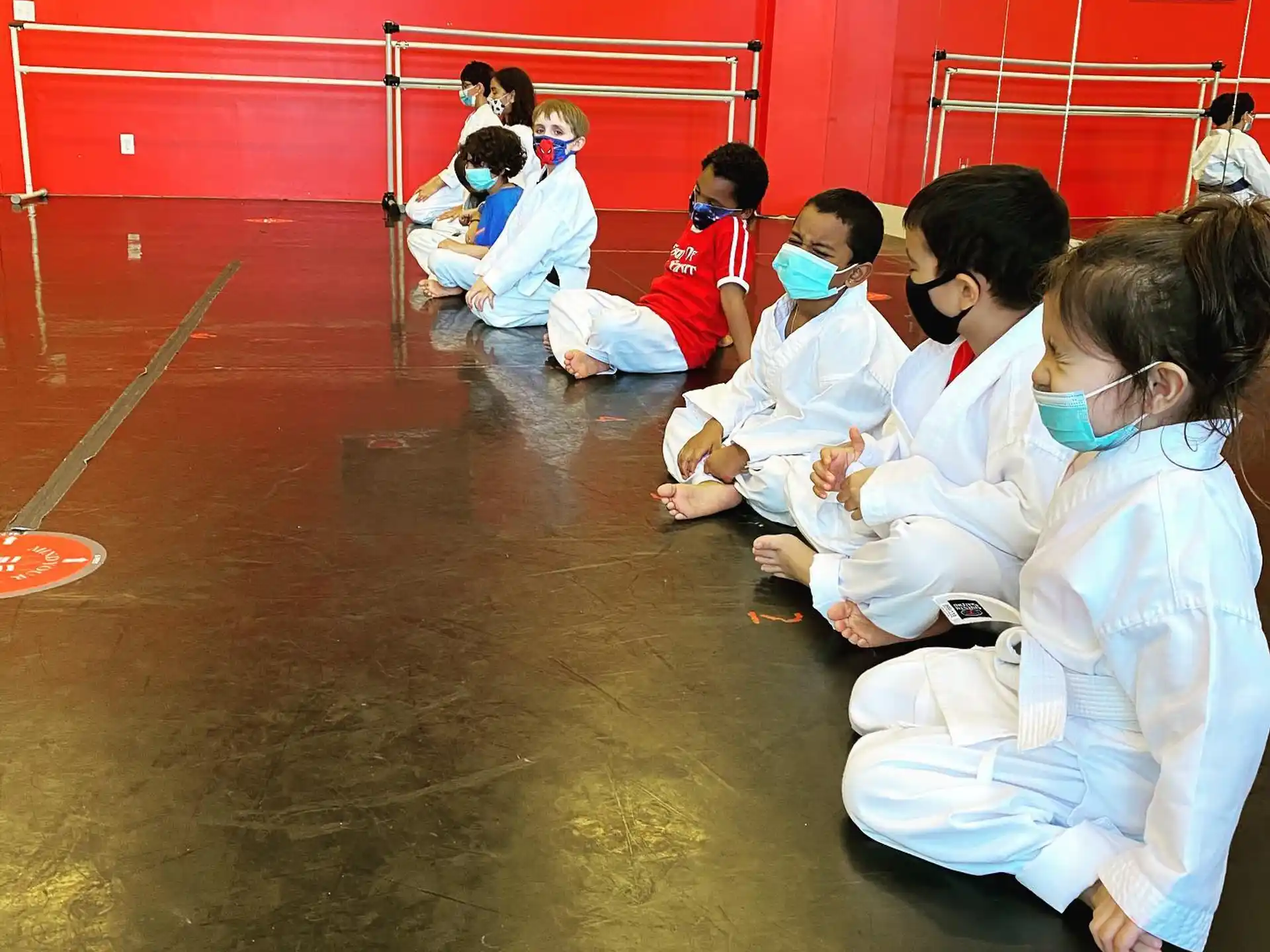 a group of people wearing white uniforms