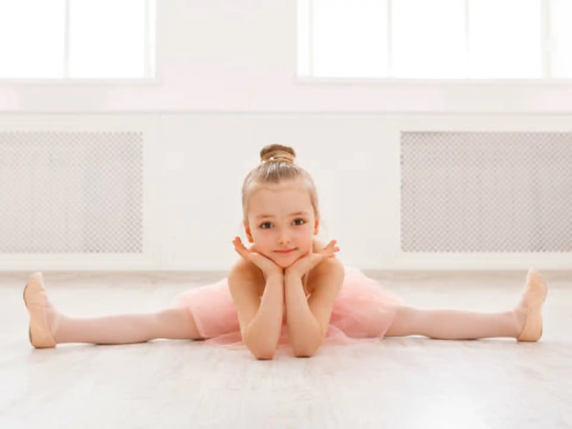 a baby lying on the floor