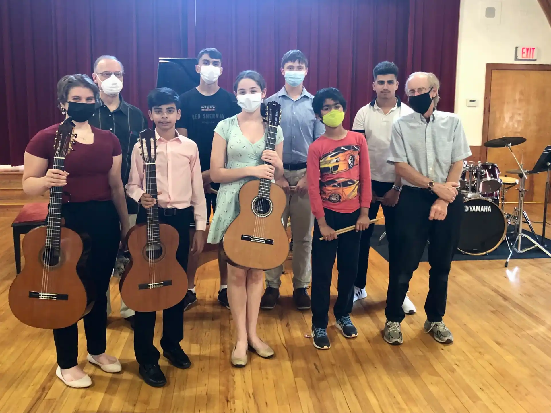 a group of people holding musical instruments