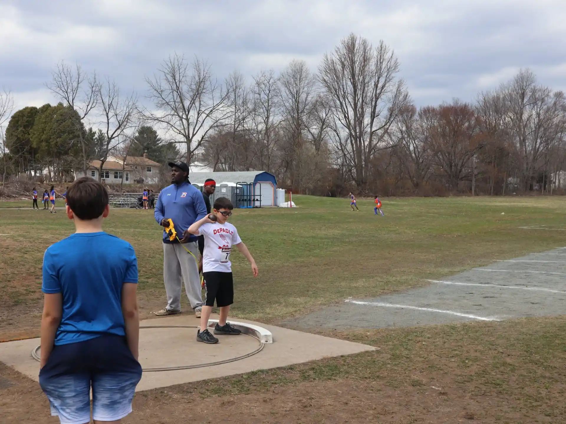 a group of people playing in a field