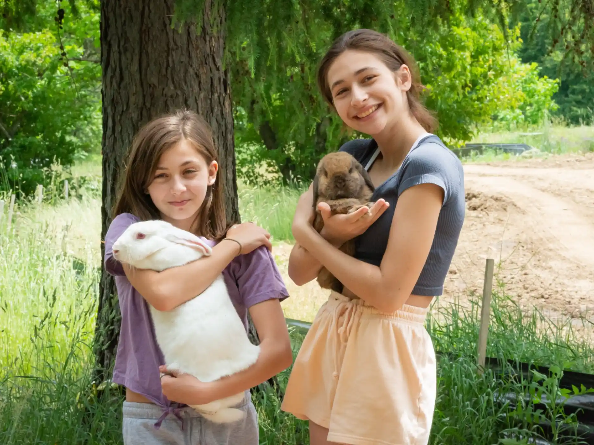 a person and a girl holding a dog