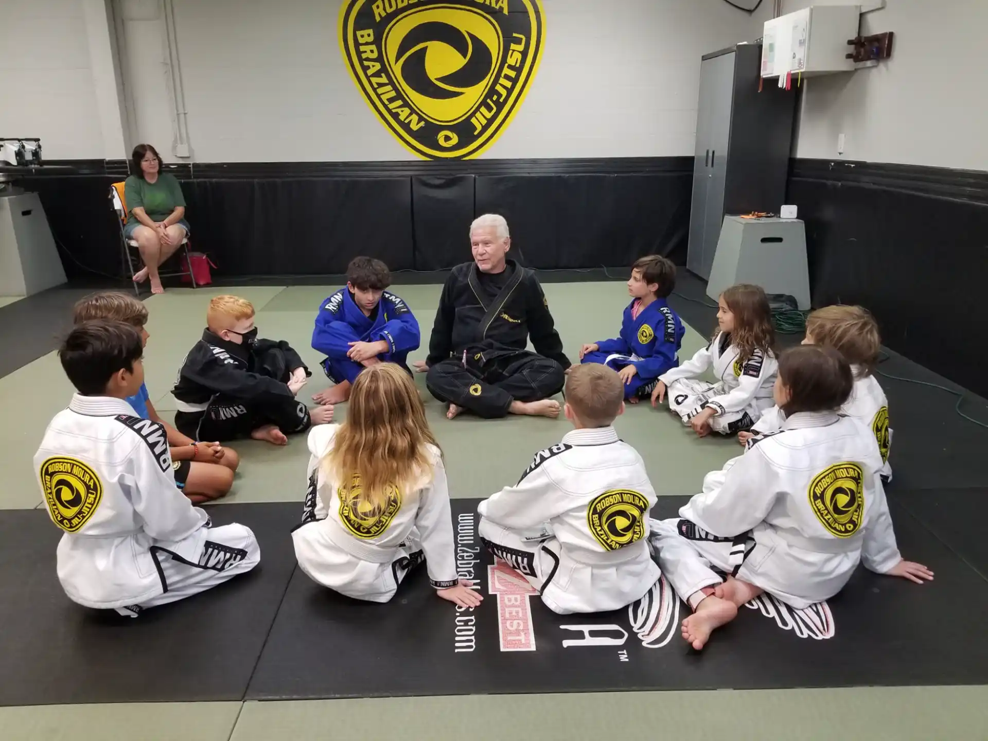 a group of people sitting on the floor