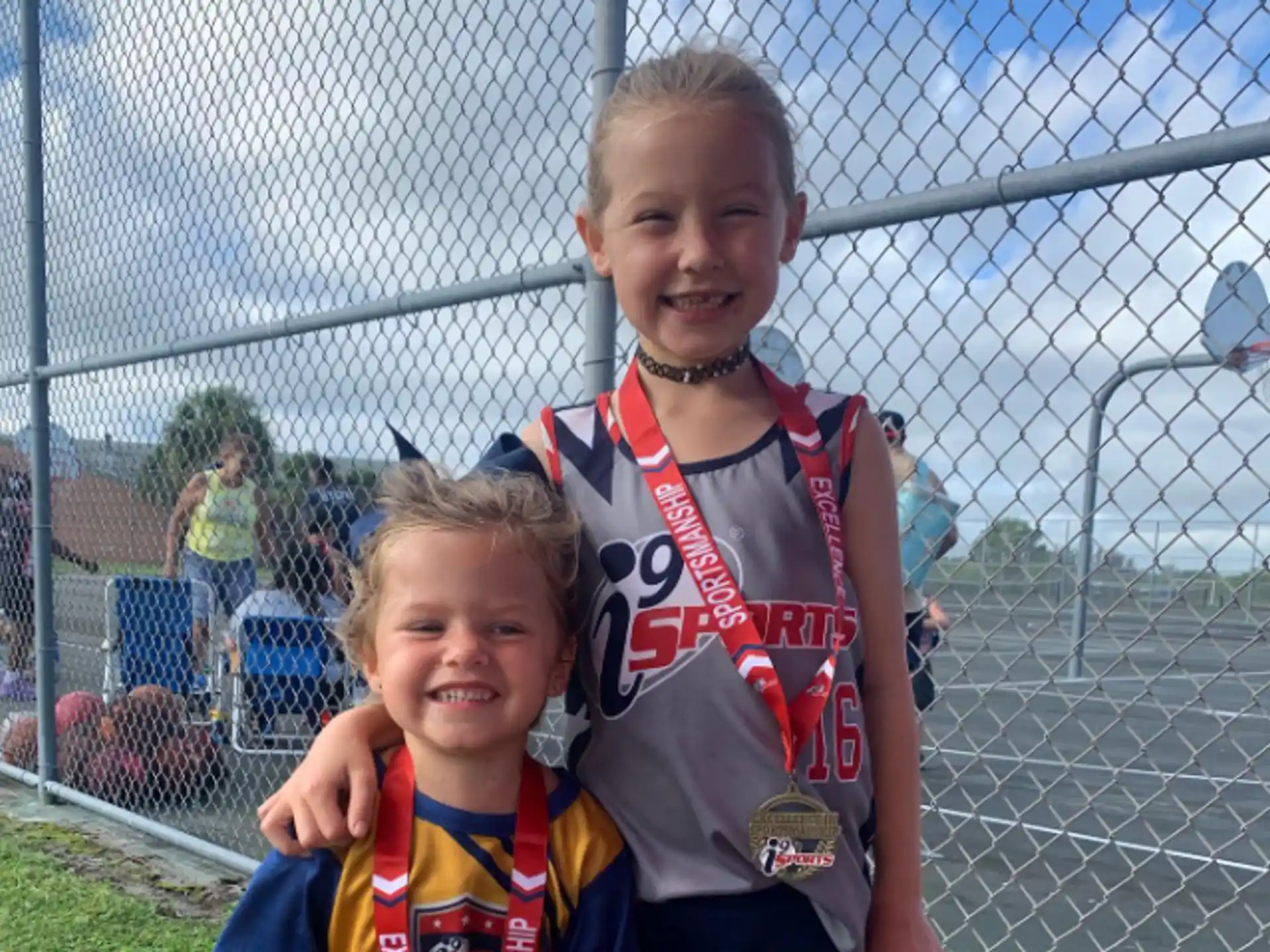a boy and girl posing for a picture