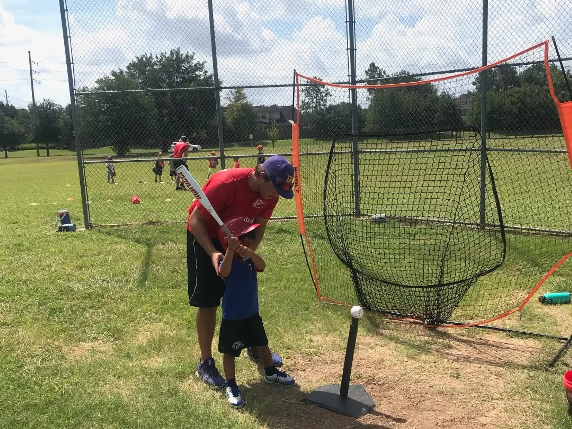 a person swinging a baseball bat