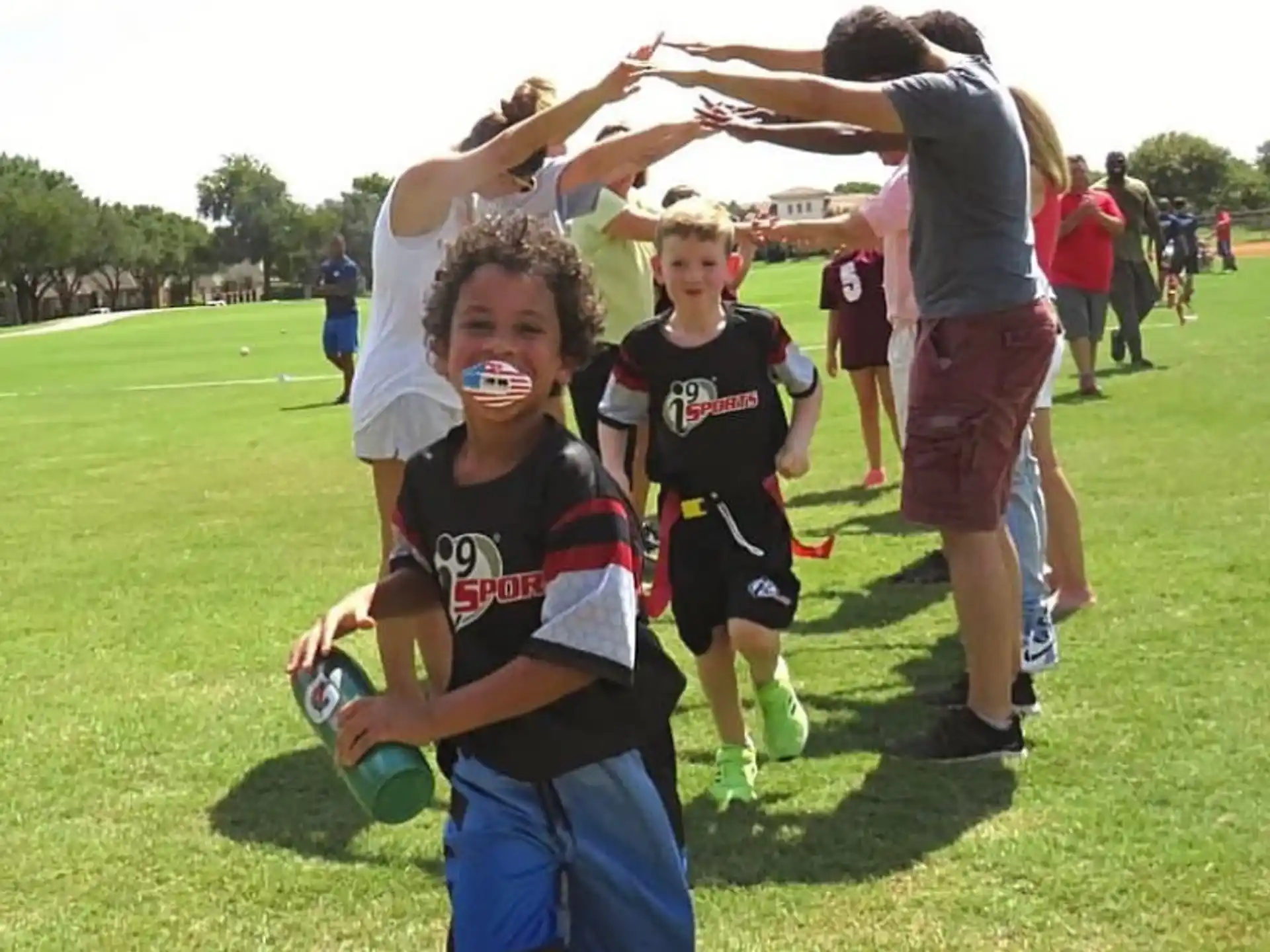 a group of kids playing in a field