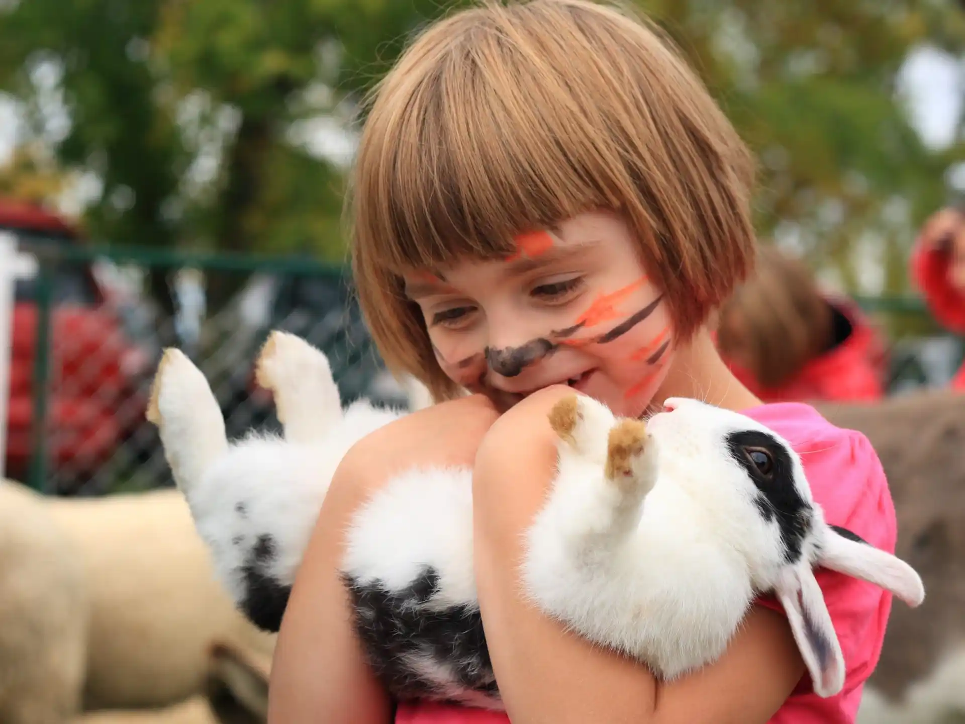 a person holding a couple of stuffed animals