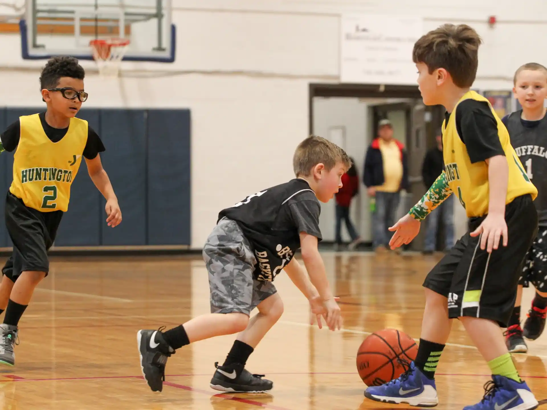 a group of boys playing basketball